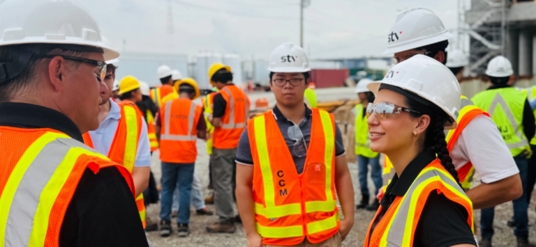 STV interns at project site in construction gear.