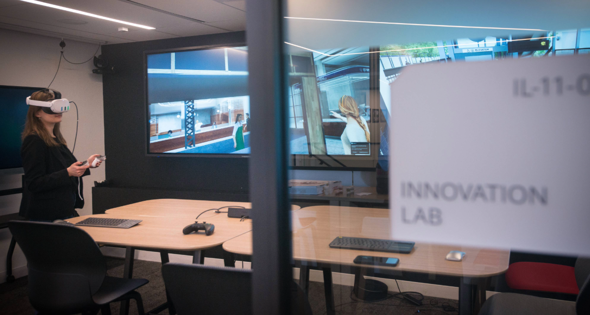 STV digital advisory team member uses Meta goggles in Innovation Lab.