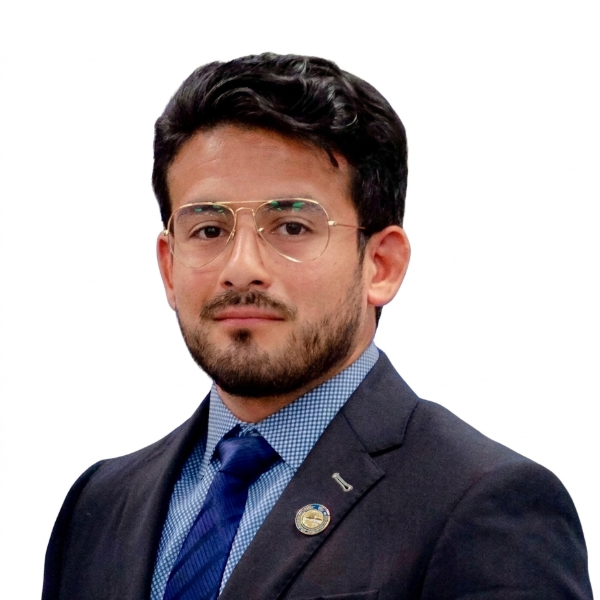 Headshot of man in gray suit with blue shirt and tie with glasses