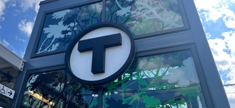 Large MBTA Logo letter T outside at train station