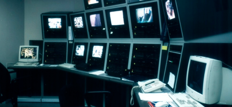 multi-screen security system with rollling chair in a security office