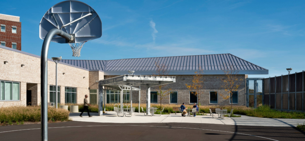 exterior of courtyard space and basketball court at the South Beach Psychiatric Residential Building in Staten Island
