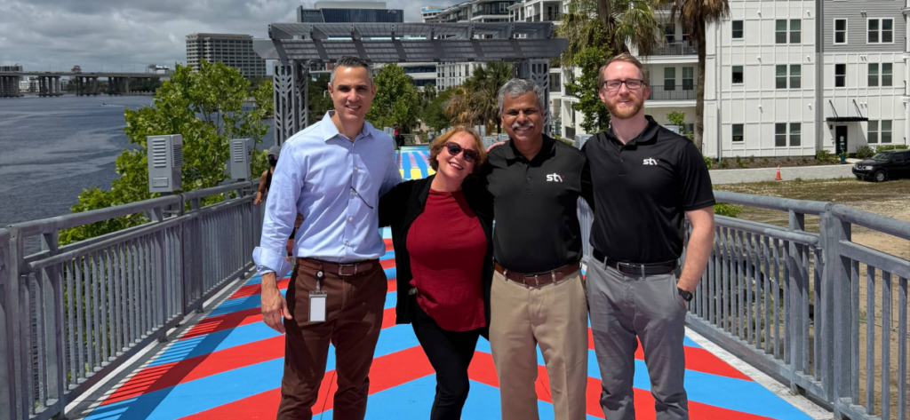 Four members of the STV Florida team at the reopening of the McCoys Pedestrian Bridge in Jacksonville, Florida