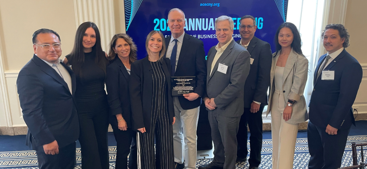 Chuck Kohler (center in photo, holding plaque) surrounded by STV colleagues at the ACEC New York award event.