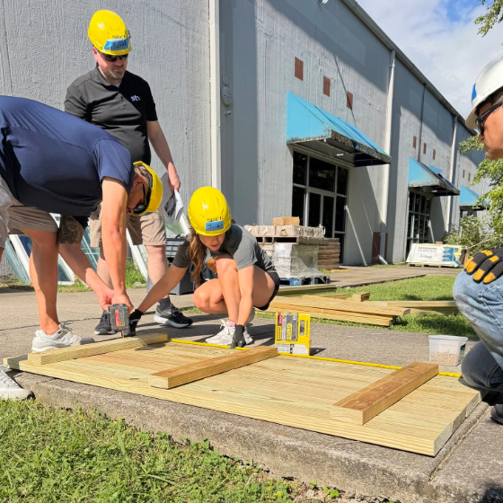 STV employees construct picnic tables during a Habitat for Humanity ReStore volunteer event.