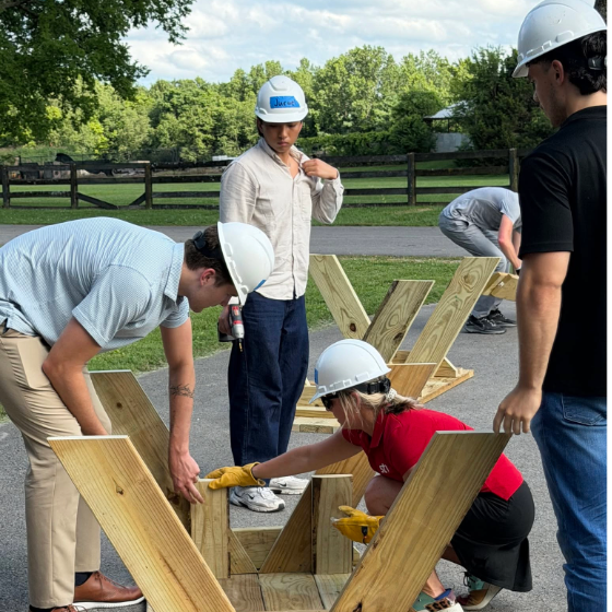STV employees construct picnic tables during a Habitat for Humanity ReStore volunteer event.