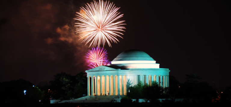 Night view of the Jefferson Memorial in Washington, D.C., with fireworks.