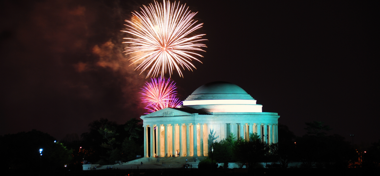 Night view of the Jefferson Memorial in Washington, D.C., with fireworks.