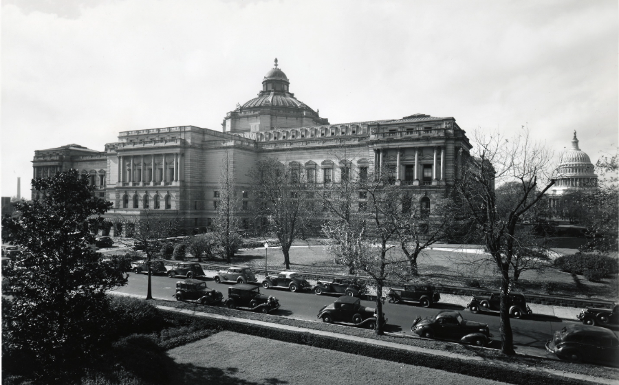 Historical image of the Library of Congress Annex in Washington, D.C. with the U.S. Capitol dome in the background.