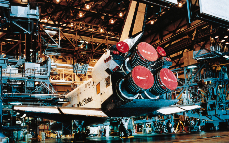 A NASA space shuttle awaiting maintenance at the Orbiter Processing Facility at Kennedy Space Center in Florida.