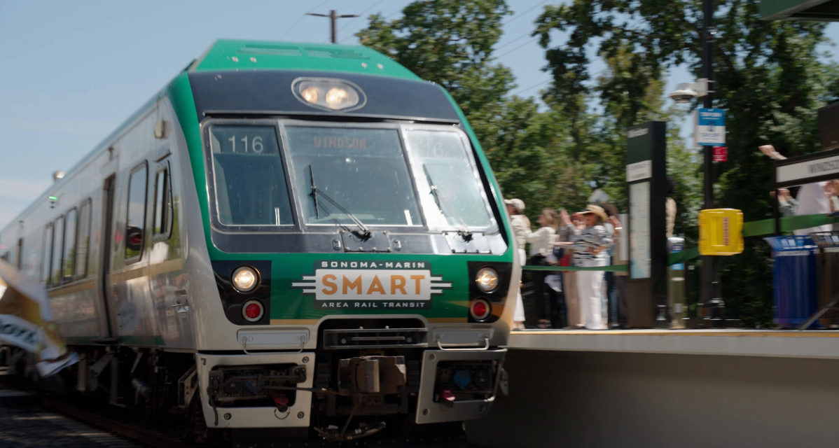 A SMART Windsor Station train approaches Windsor Station at its ribbon cutting.