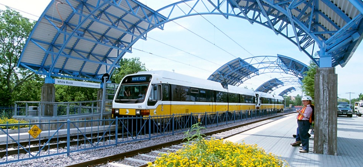 View of DART Dallas Area Rapid Transit White Rock Station coming into station