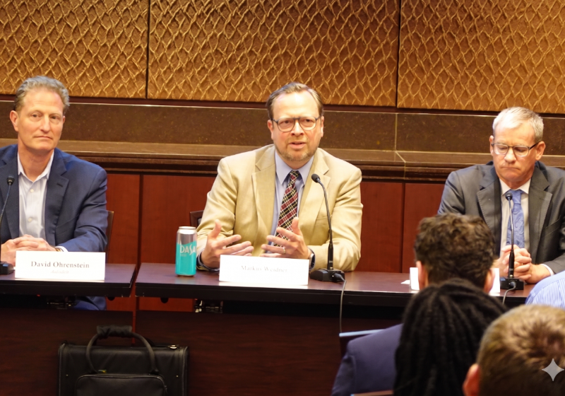 Markus Weidner (center in photo) presents on panel.