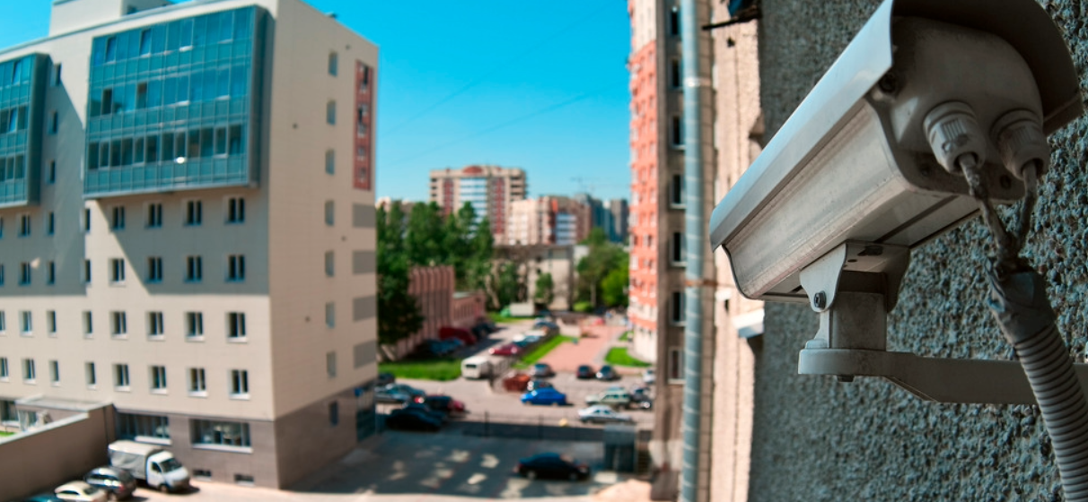 security camera overlooking parking lot and buildings