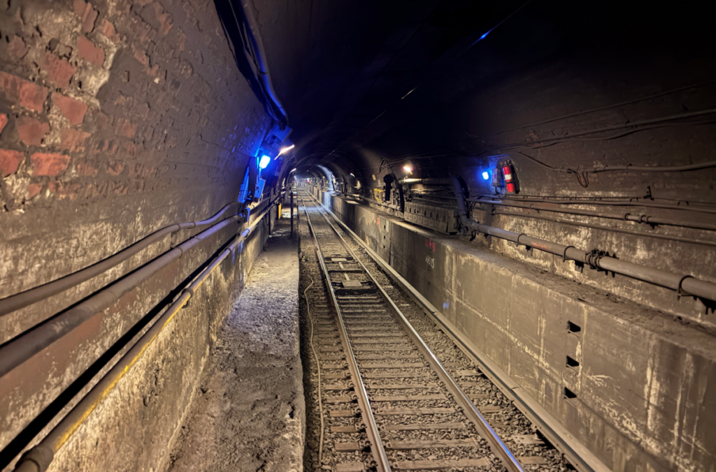 East River Tunnel under construction showing interior of tunnel and track bed.