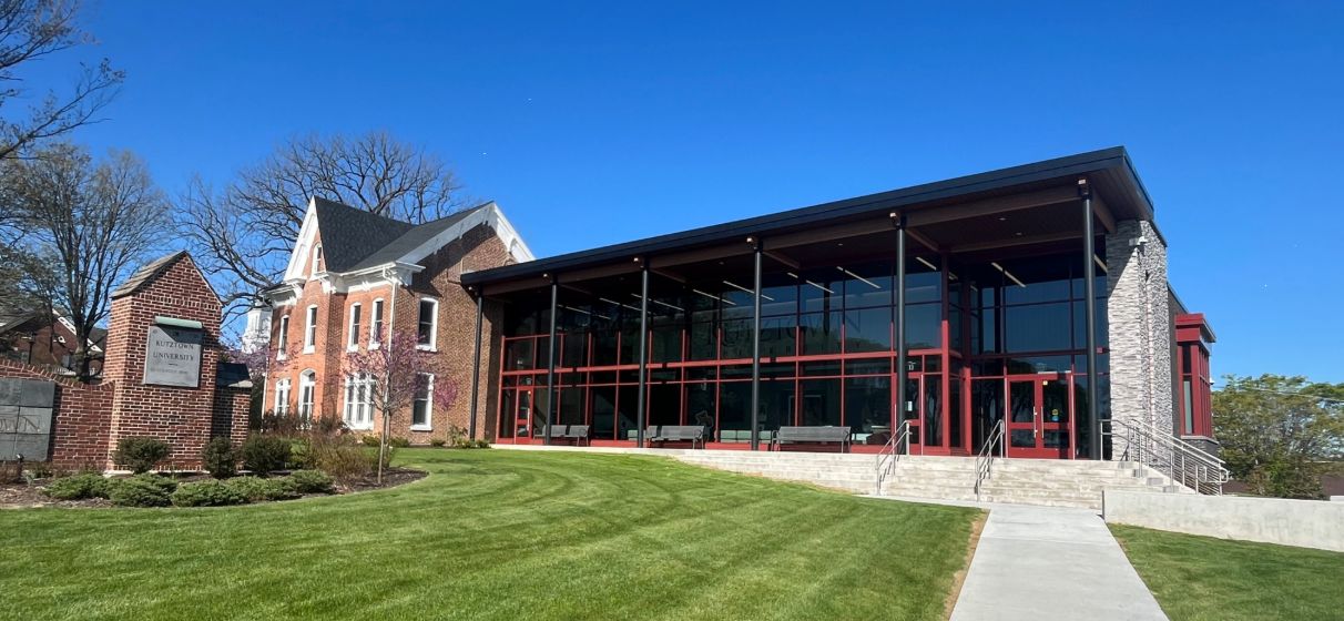 View of front entrance of the Hawkinson Welcome Center at Kutztown University.