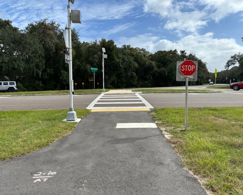 View of stop sign and crosswalk along Amelia Island Parkway