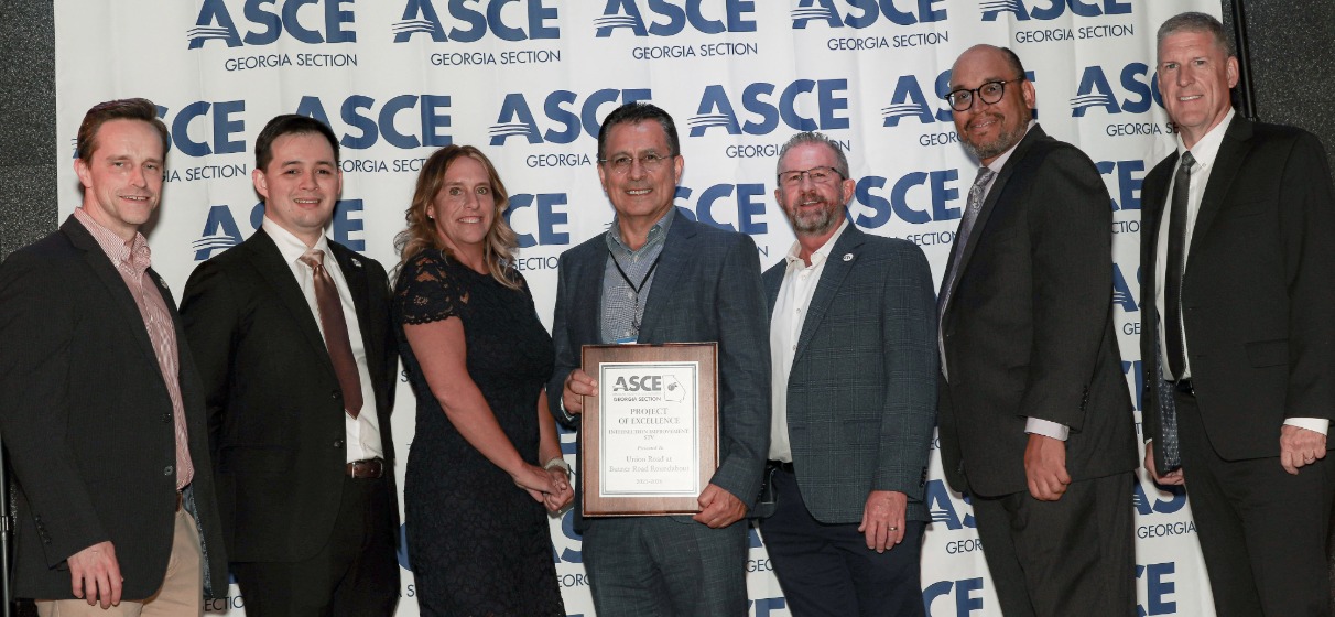 STV team members and clients pose with award plaque at ASCE Georgia project excellence awards.