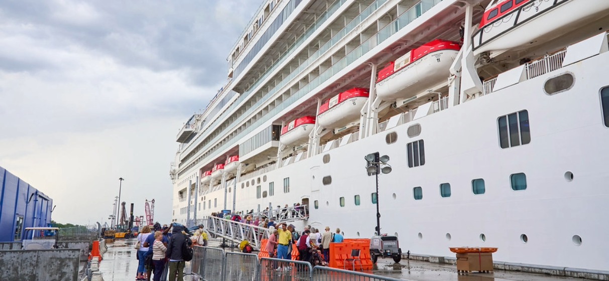 Groups of people to the left of cruise ship at the Port of Philadelphia