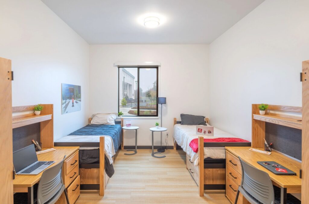 Sample dorm room with two beds and two desks n the student housing building at Sierra College in Rocklin, CA.