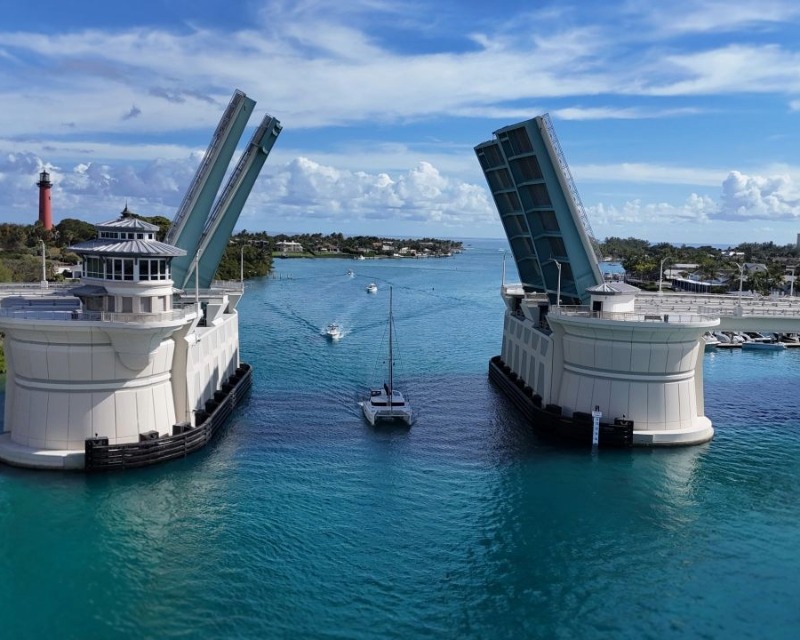 Boat passing through Jupiter Bascule Bridge in open position.