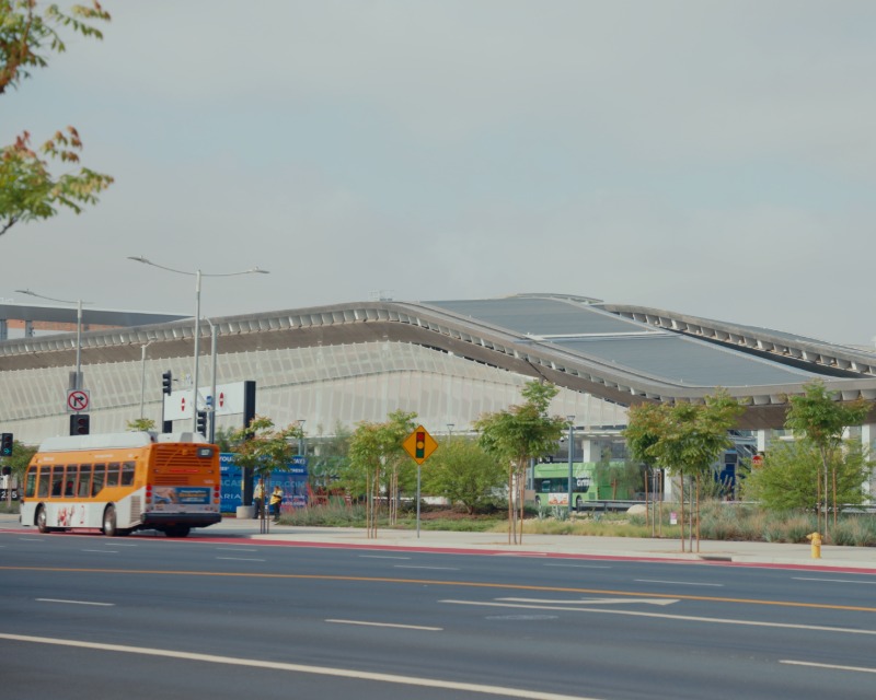 LA Metro bus parked outside of LAX/Metro Transit Center in California.